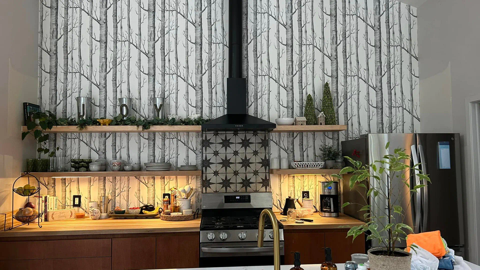modern kitchen remodel with forest themed backsplash